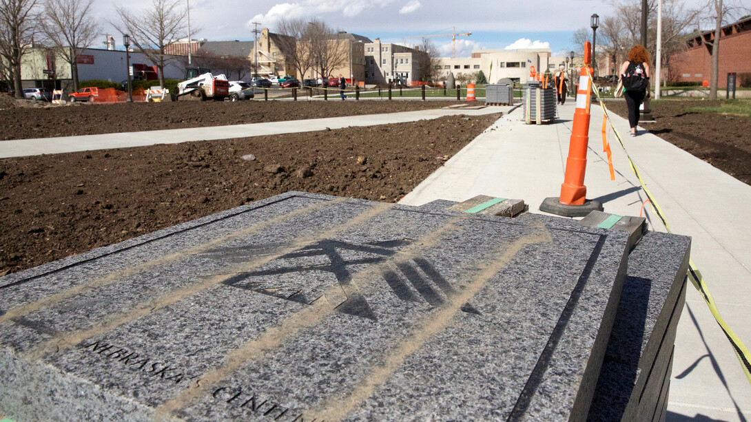 A stack of pavers rests alongside the Centennial Mall sidewalk outside UNL's Andersen Hall. The project, which has limited access to the College of Journalism and Mass Communications for two years, is scheduled for completion this spring.