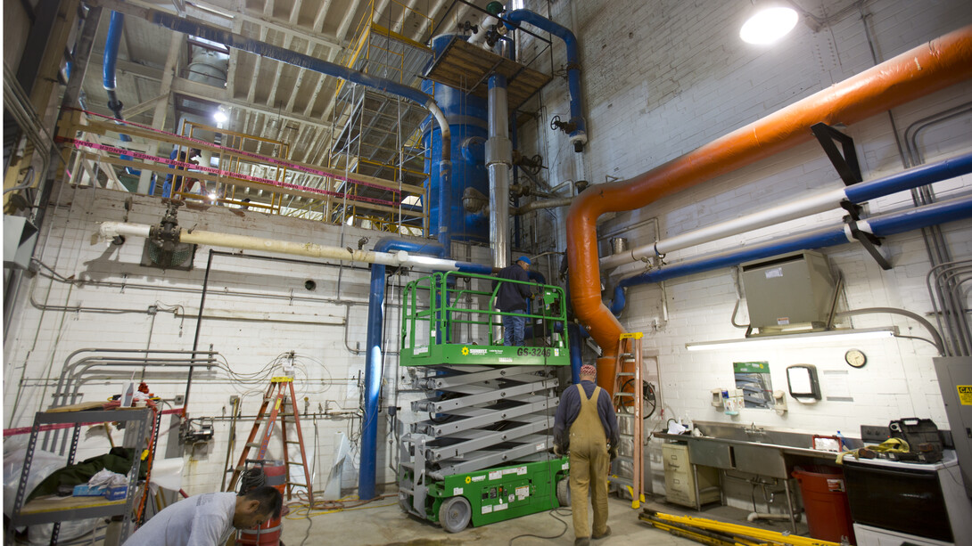 Maintenance crews begin work that will allow for the replacement of the boiler deaerator (large, blue strucutre at top, center) in the City Campus utility plant.