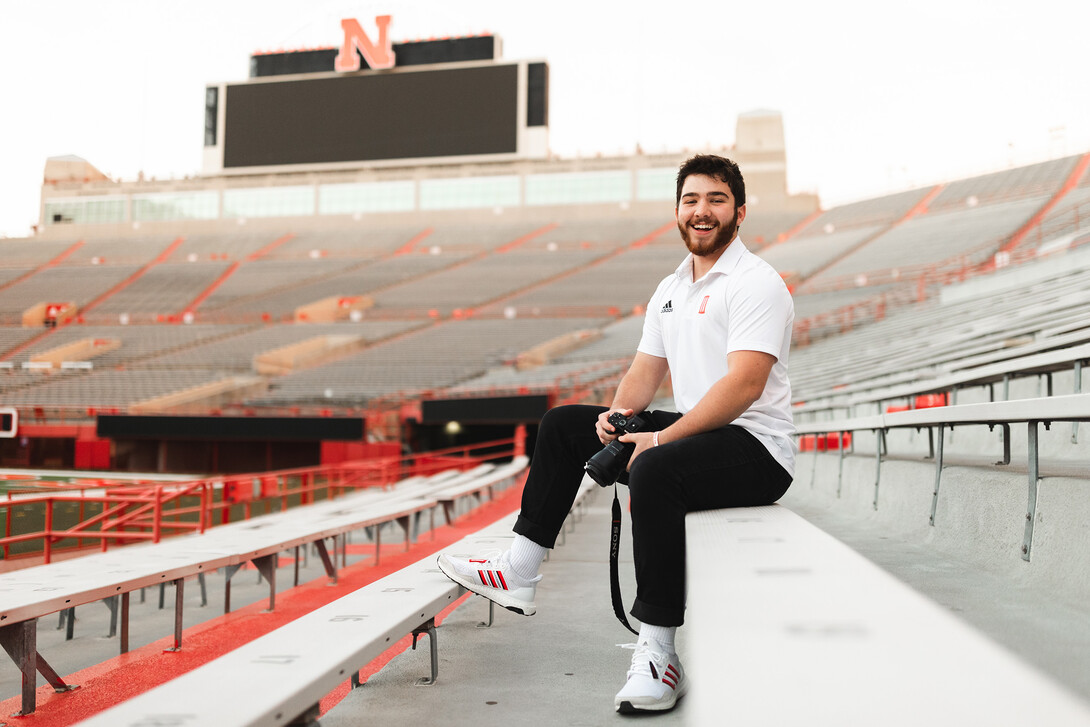 Ethan Weldon is photographed in Memorial Stadium, where he's worked as part of the social media department for NU Athletics.