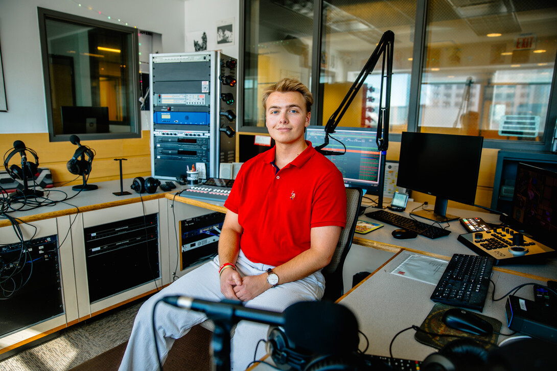 Schrantz, a junior sports media & communication and broadcasting double major from Orchard Park, NY, pictured here in the KRNU headquarters.  