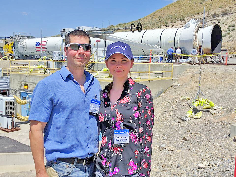 Alexandra Dominguez and her husband, Dave, stand in front of a booster rocket at the Orbital ATK test facility in Promontory, Utah. The Dominguezes attended a ground test of the Space Launch System’s five-segment solid rocket motor on June 28, 2016.