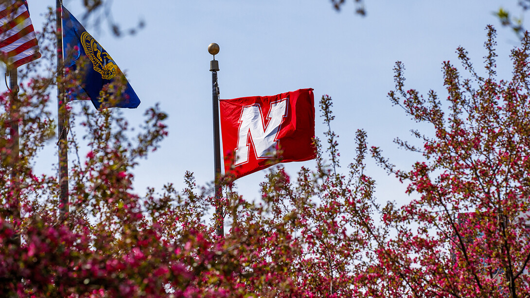 Nebraska flag flying over campus