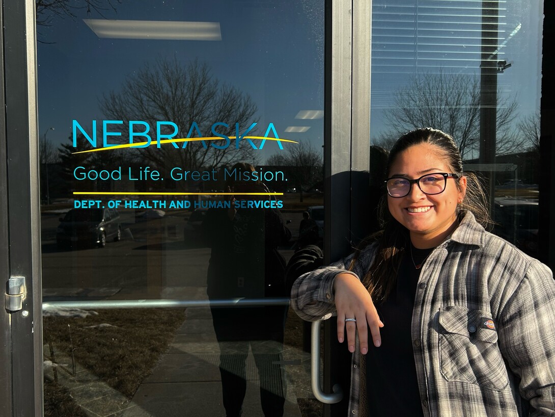Ashly Felipe-Espino, recent UNL alumni stands in front of Dept. of Health and Human Services
