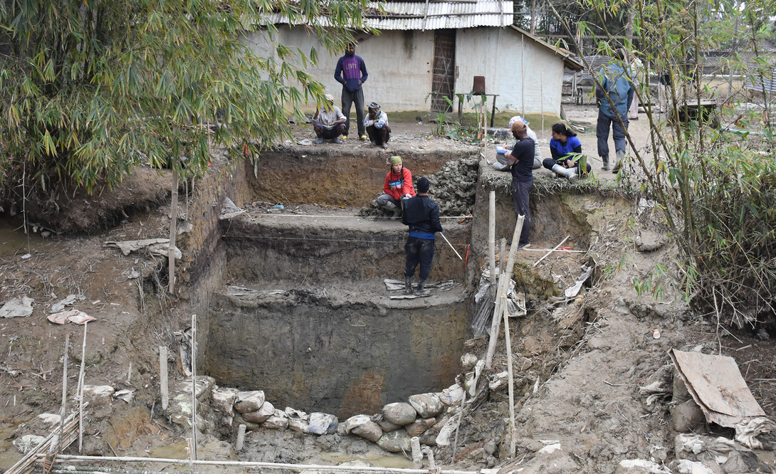 Members of an excavation team work in Assam State in northeastern India.