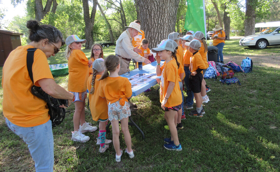 Bob Diffendal leads a group of campers through a nature activity.