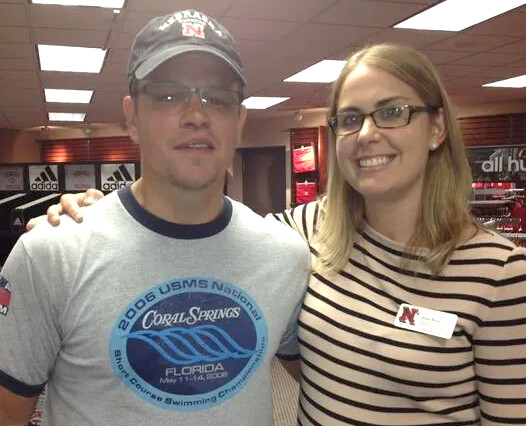 Nebraska's Jenni Brost stands in the Nebraska Bookstore with Matt Damon during New Student Enrollment in 2013.