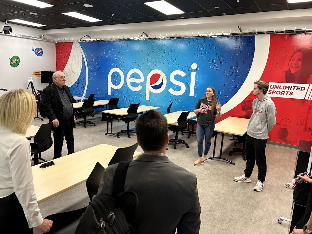 Krysten Collins speaks with visitors to the Experience Lab. 