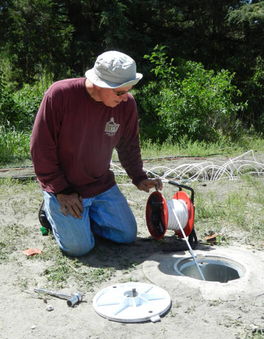 UNL's Steve Comfort worked with current students and an alumnus to craft a new candle that may help remove contamination from groundwater near Grand Island.