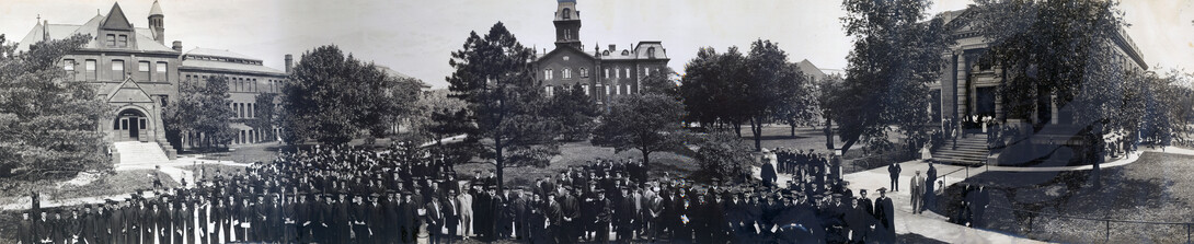 Nebraska graduates, faculty and administrators pose for a panorama in this photo from around 1910. Buildings pictured (from left) are Architecture Hall (then the library), University Hall and the old Administration Building.