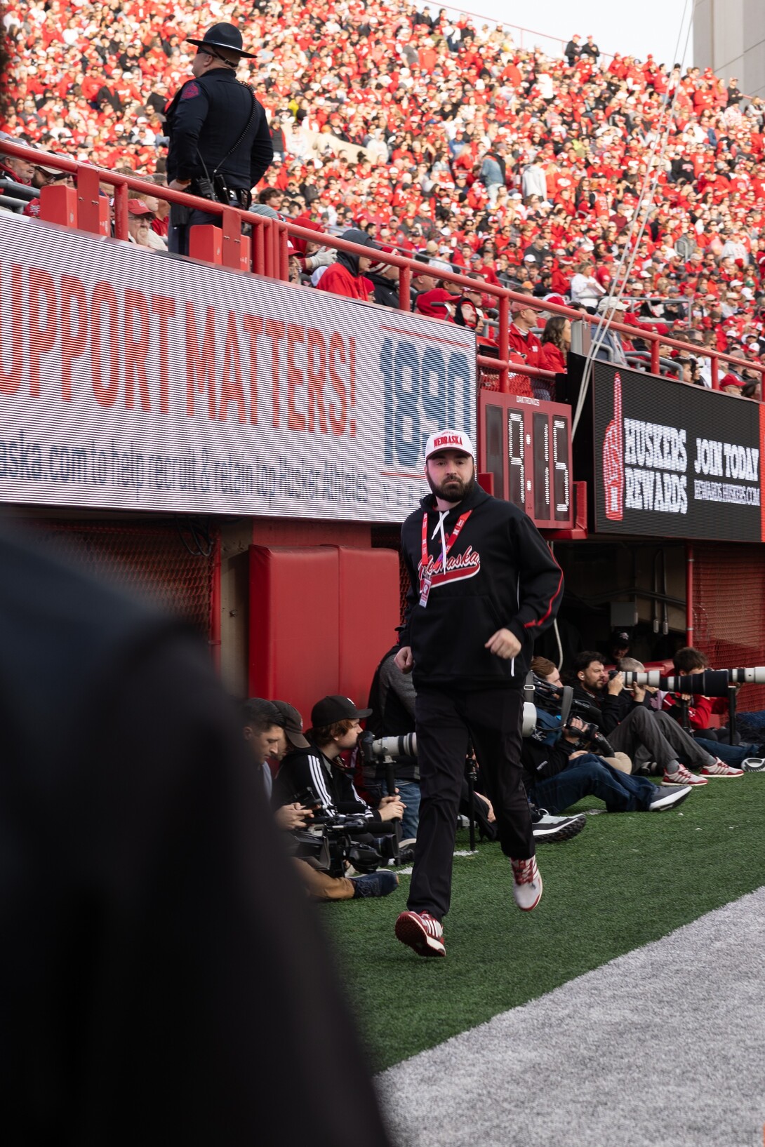 Connor O'Dell running across the endzone in Memorial Stadium.