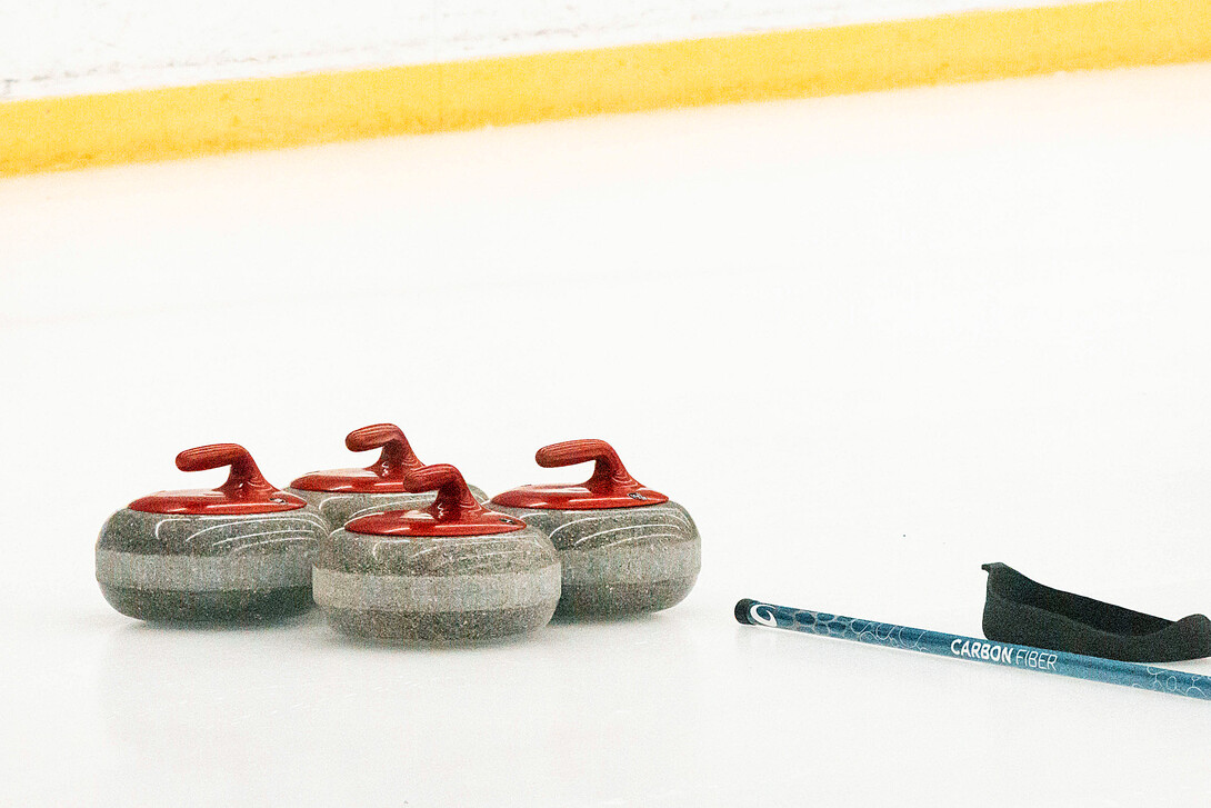 Curling stones sit on the ice during the Cornhusker Bonspiel Jan. 20.