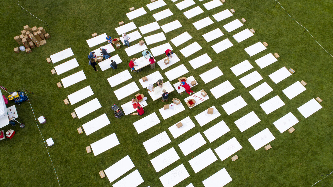 Volunteers start arrange panels at the start of the Guinness Book of World Records attempt on Aug. 31.