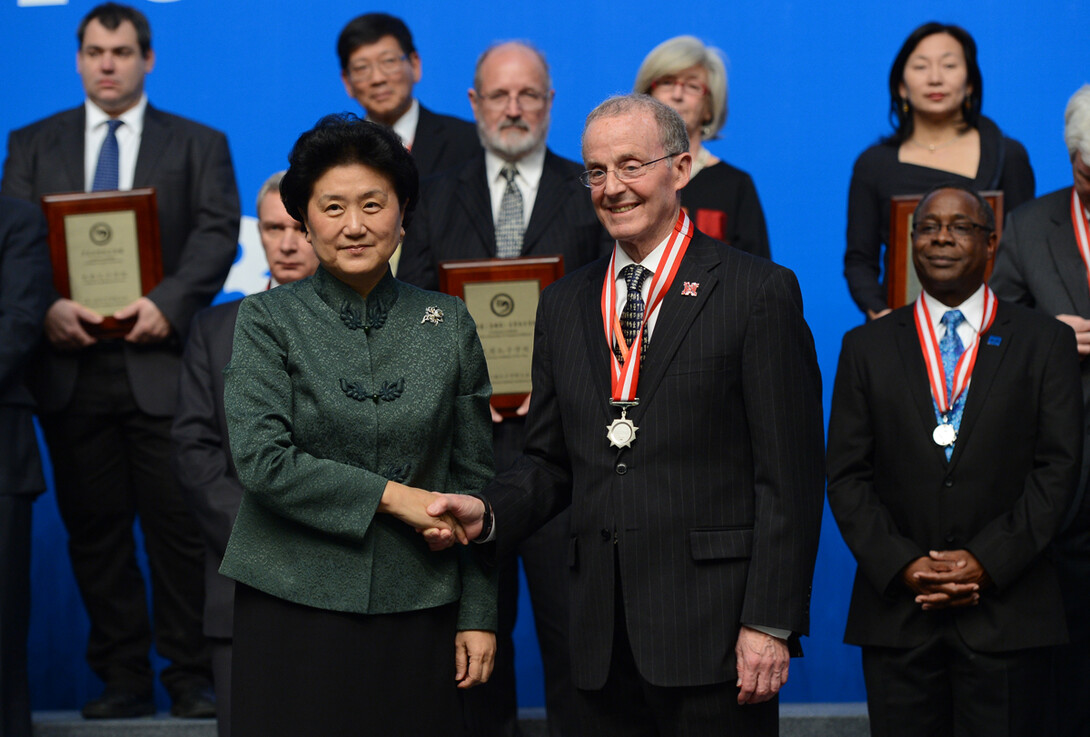 Chancellor Harvey Perlman shakes hands with Liu Yandong, vice premier of state council of the People's Republic of China, during the Confucius Institute Conference award ceremony.