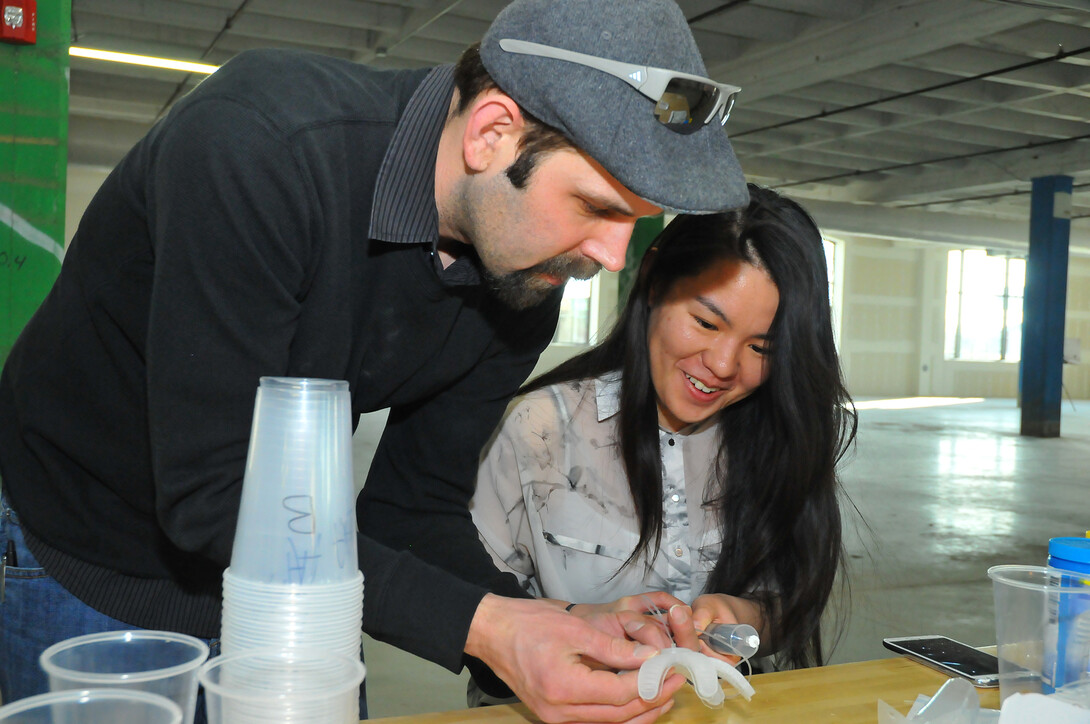 Stephen Morin, assistant professor of chemistry, and Xinchi Zhang, a marketing major, work on a soft robot as part of UNL's "Making for Innovation" course at Nebraska Innovation Campus.