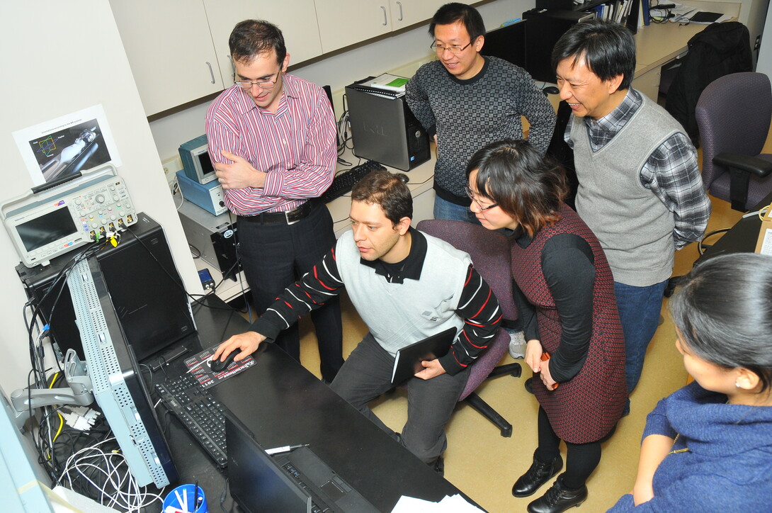 Faculty from Xi’an Jiaotong University tour the lab of Shadi Othman in Chase Hall on Dec. 5. Pictured (clockwise from top left) are Othman, Zhongji Han (UNL), Zhimao Yang (XJTU), Yong Mei Chen (XJTU) and Vahid Khalilzad Sharghi. Other members of the XJTU group not pictured are Lijuan Wang, Xili He and Yaping Fan.