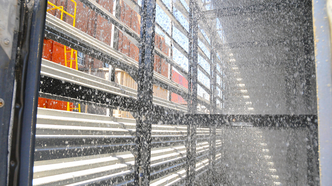 Water rains down inside a cooling tower by UNL's City Campus utility plant at 14th and Avery streets. Construction of a new cooling tower to replace an old model will begin May 27.