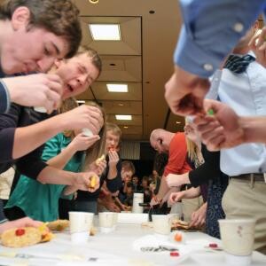 Students race to eat their edible vehicles at the close of a previous Incredible, Edible Vehicle Competition.
