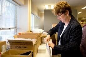 Verhein sorting diplomas.