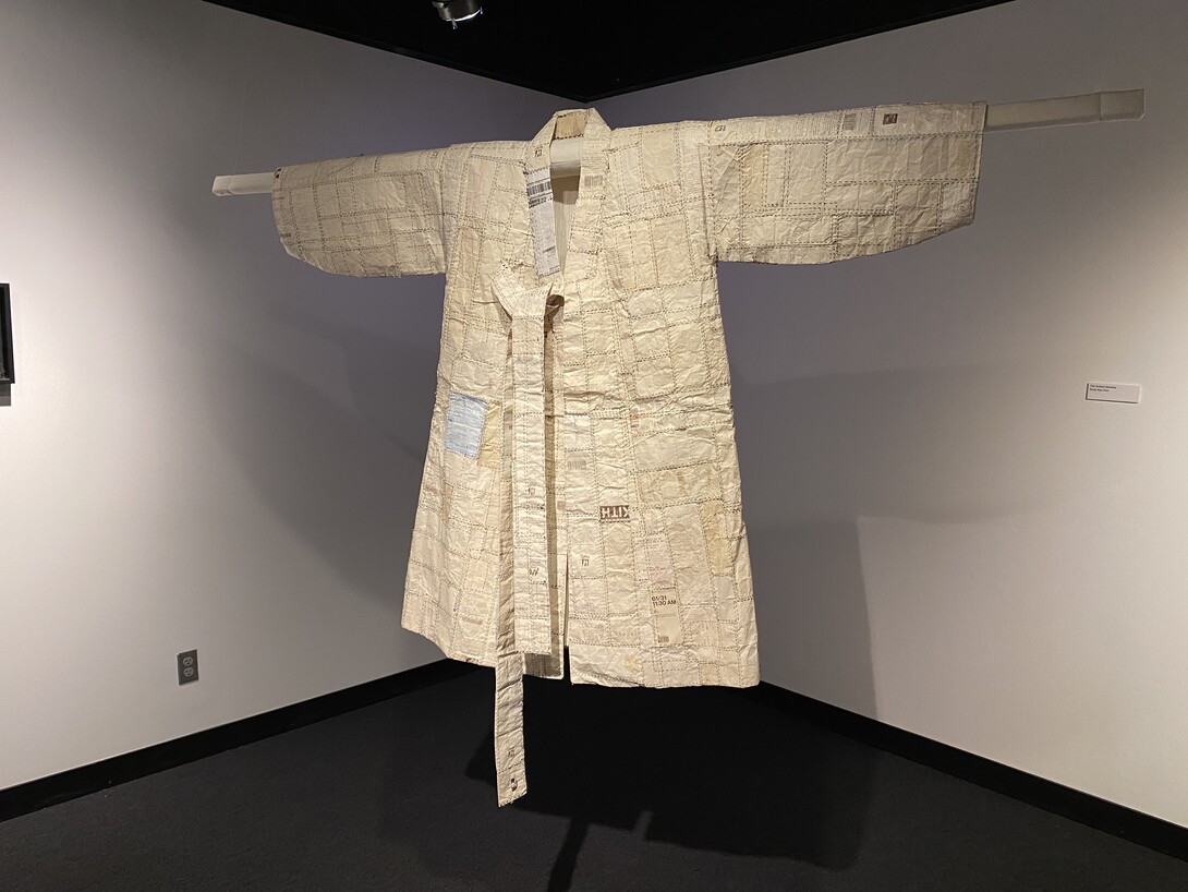 A “hanbok,” or Korean robe constructed of receipts. The piece was crafted by Dong Kyu Kim and is one of the exhibits featured in the Robert Hillestad Textiles Gallery.