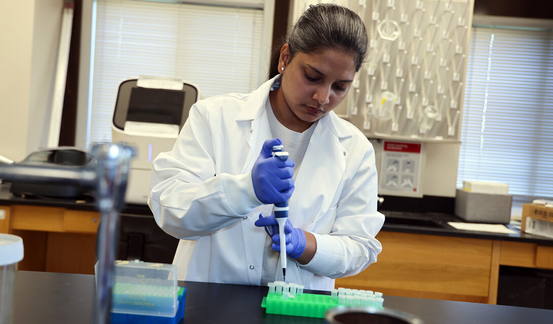 Esha Kaler performs RNA extraction protocol in a lab in Entomology Hall on East Campus.