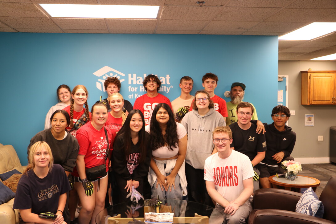 University Honors Program and Learning Community students pose for a photo at Habitat for Humanity.