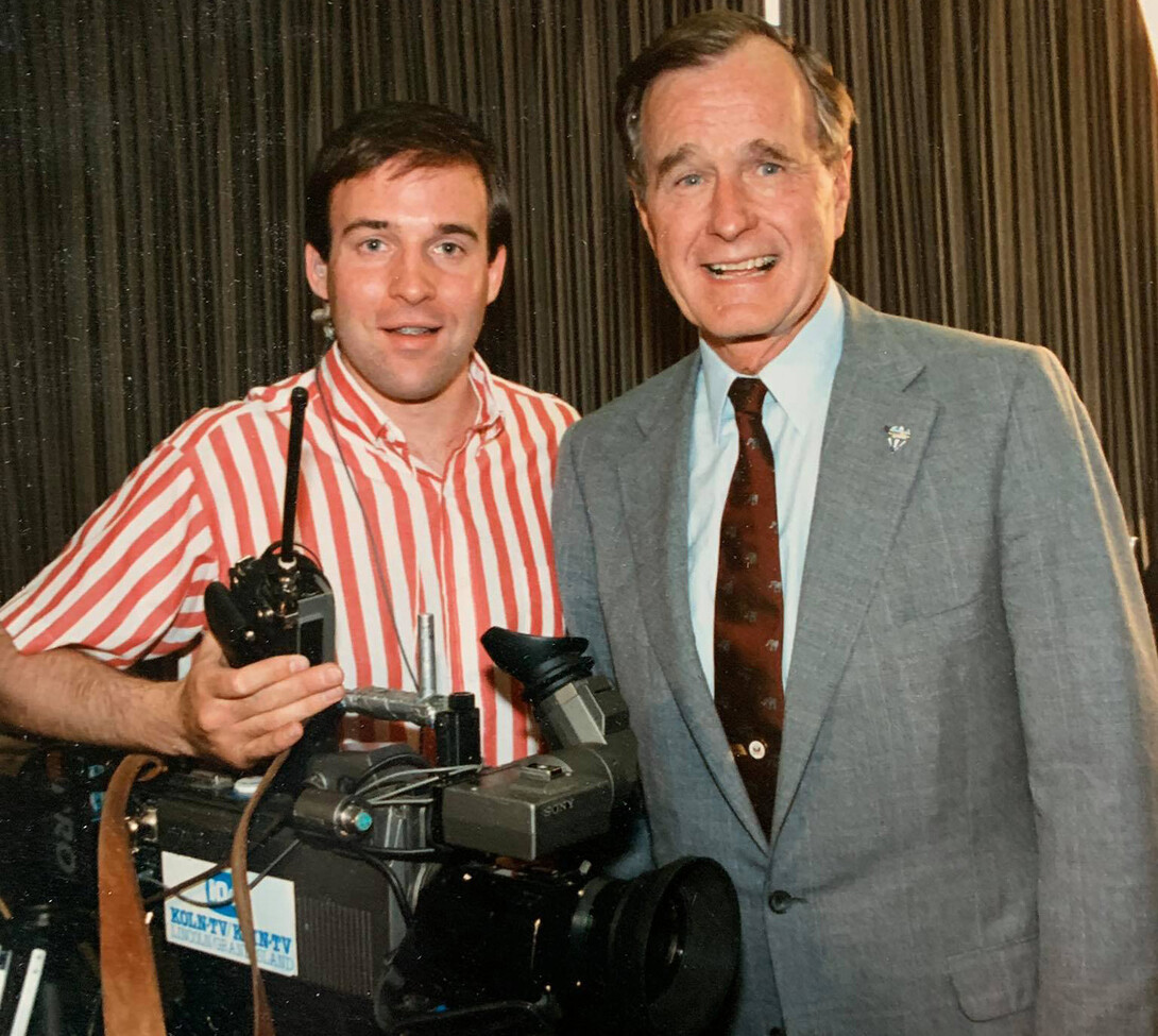 Nebraska's Dave Fitzgibbon, then a videographer with KOLN, poses with President George H.W. Bush during the 1998 campus visit. The photo was taken by a White House photographer.