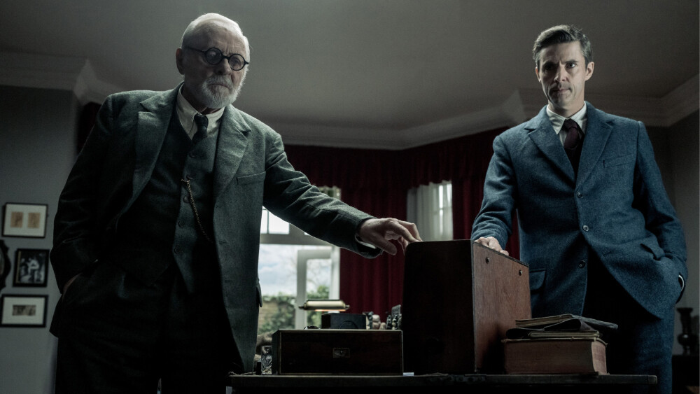 Image inside an office showing a discussion between actors Anthony Hopkins and Michael Goode as Sigmund Freud and C.S. Lewis (respectively) from the film "Freud's Last Session."