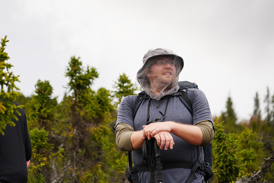 Trevor Frost takes a photo amid the Alaskan wilderness.