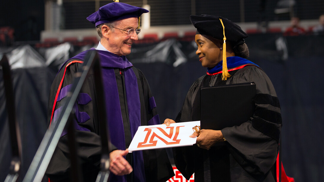 Chancellor Harvey Perlman (left) presents an honorary Doctor of Fine Arts degree to Barbara Hendricks during May 9 commencement exercises in Pinnacle Bank Arena. Hendricks, an opera singer and UNL alumna, delivered the undergraduate commencement address.