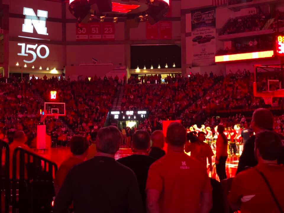 Husker fans are bathed in red at the start of the Charter Week halftime extravaganza at Pinnacle Bank Arena on Feb. 13.