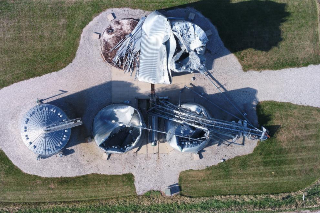 Overhead view of grain bins after derecho