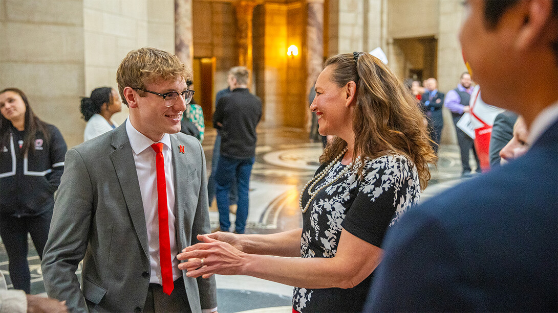 ASUN President Paul Pechous chats with Senator Danielle Conrad during I Love NU Day