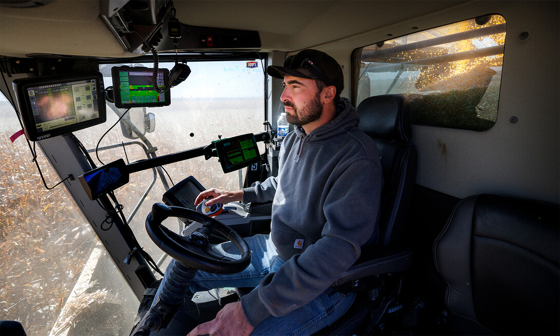 Andrew McHargue in cab of combine