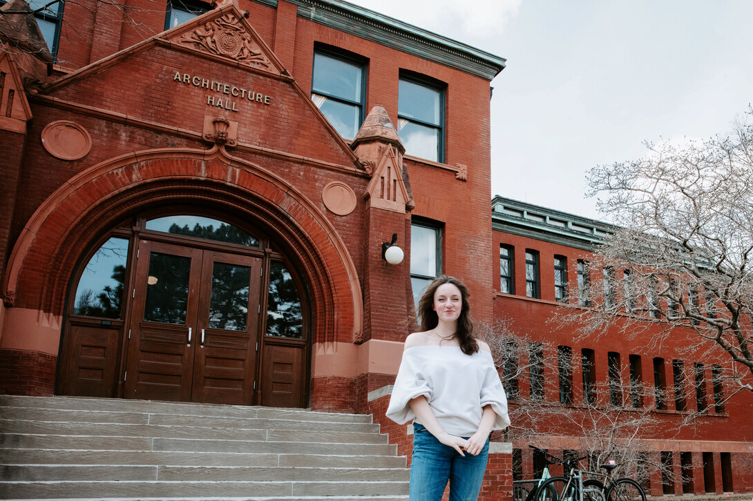 Pictured here in front of Architecture Hall, Willoughby – who grew up in Montreal – hopes to continue to use architecture to support nonprofits and underserved communities throughout her career.  