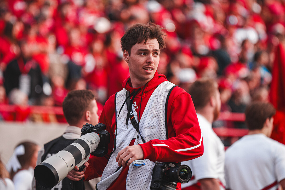 Tyler Hurst gets on the field to photograph a home Husker football game.