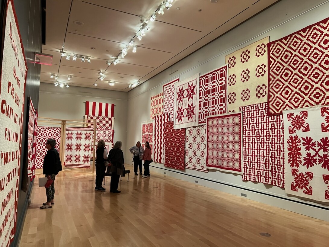 Wall of Joanna S. Rose's Red and White quilts 