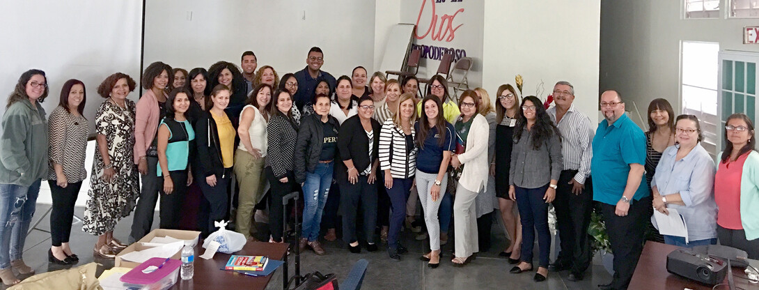 First responders in Puerto Rico pose with Denise Bulling during a workshop earlier this summer.