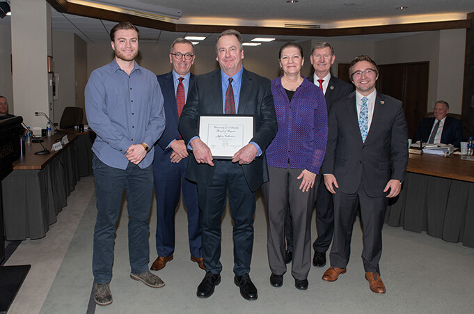 Kudos winner Jeff Culbertson (center) stands with (from left) his son, Lucas Culbertson; Chancellor Ronnie Green; his wife, Lisa Culbertson; Ted Carter, NU-system president; and Keith Ozanne, NU regent. The photo, taken on Feb. 7, 2020, was the only one taken of the 2020 Kudos winners as other NU Regent meetings were held virtually.