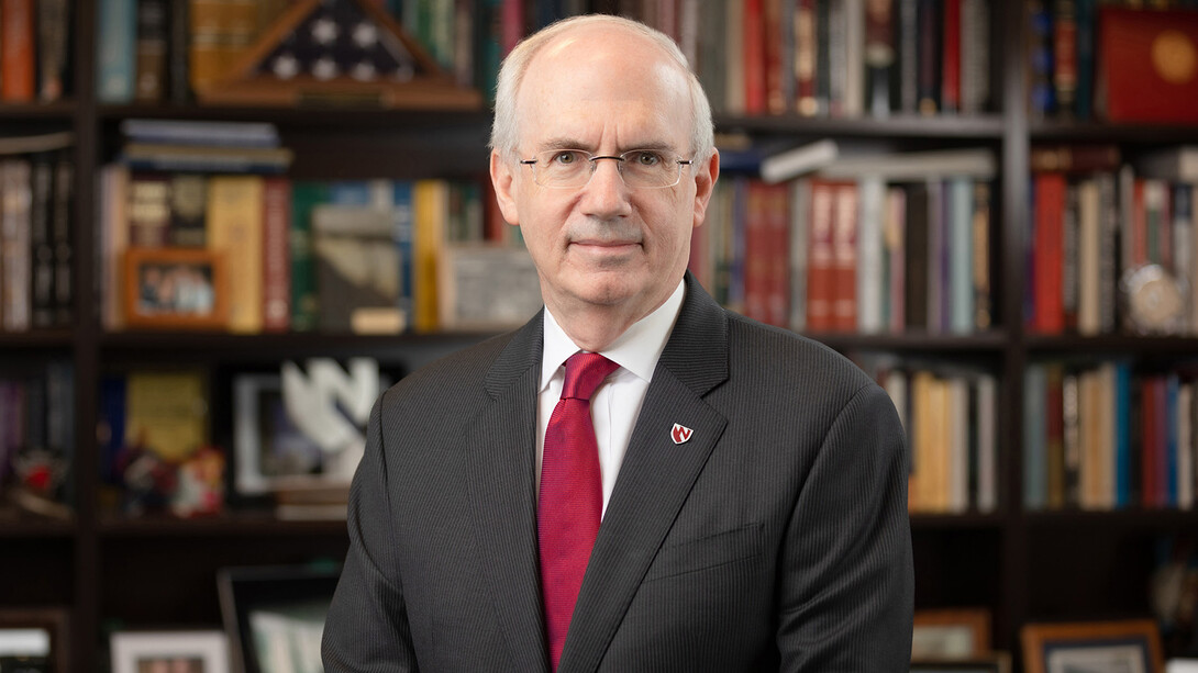 Photo of Dr. Jeffrey Gold in an office with filled bookshelves in the background.