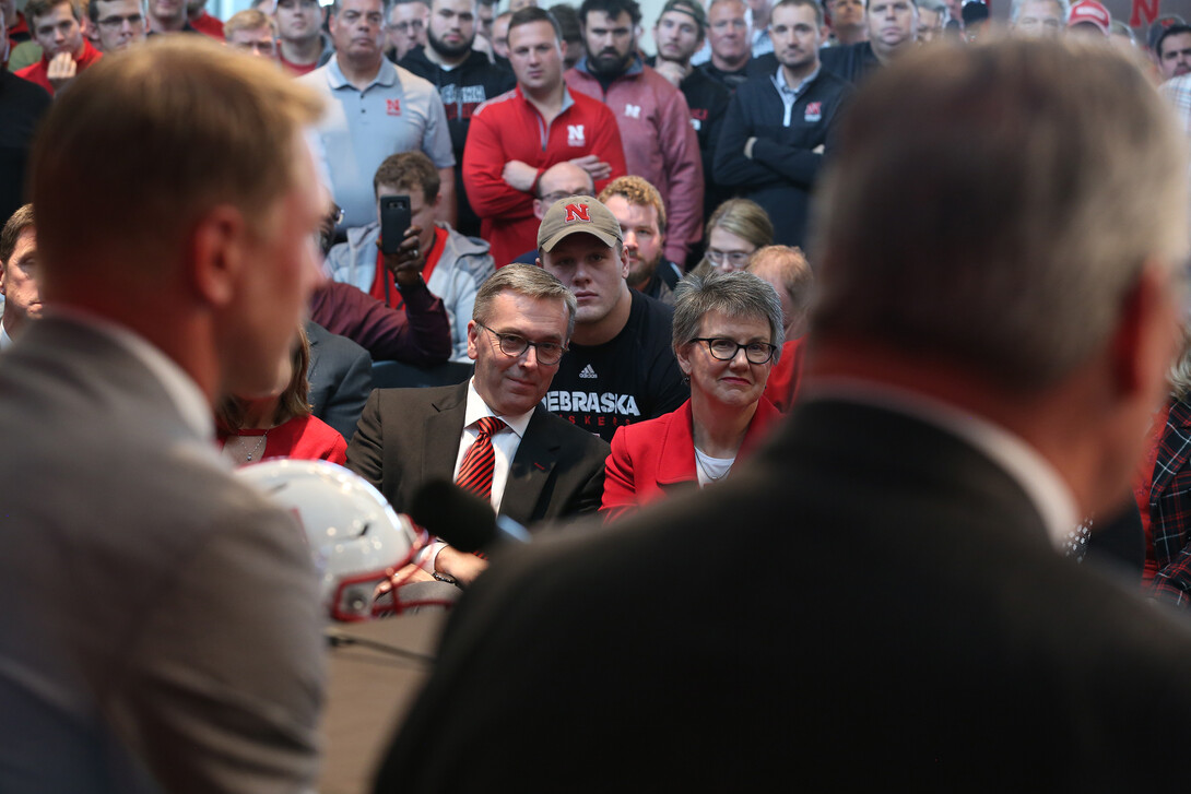 Chancellor Ronnie Green and his wife, Jane, smile as Scott Frost answers questions from the media during a Dec. 3 news conference in Memorial Stadium.