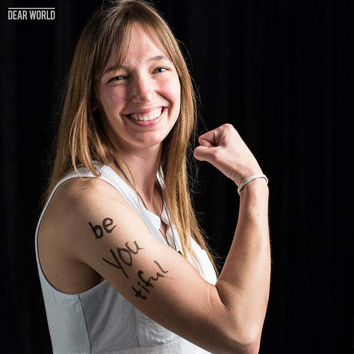 Kathryn Kuczaj, coordinator for training and assessment for Student Involvement, poses for a Dear World photo during a 2015 conference in New Orleans.