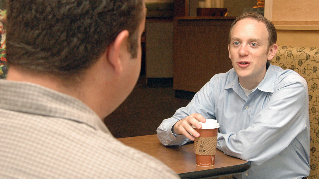 UNL's Ari Kohen, right, speaks with a student in this file photo.