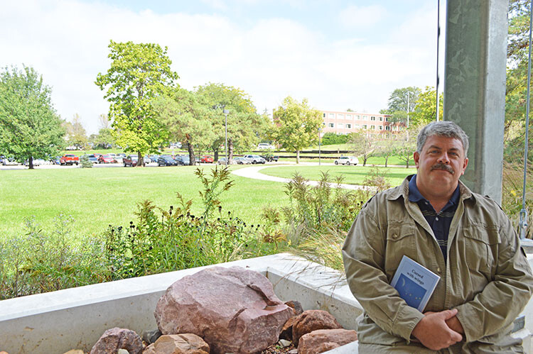 Larkin Powell, professor of conservation biology and animal ecology, recently published "Cursed with Wings," a poetry and prose collection. (Mekita Rivas | Natural Resources)