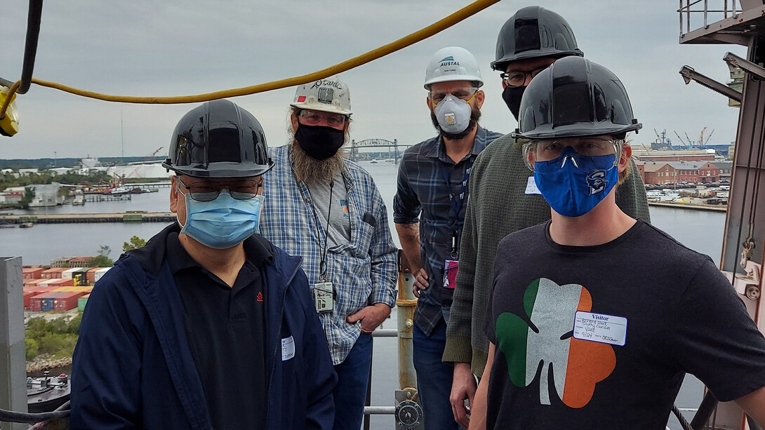 The Nebraska Engineering research team that conducted a test in Norfolk, Virginia, earlier this fall included Yongfeng Lu (left), Tim Carlson (far right) and Nick Pease (obscured, second from right). Others pictured are (right of Lu) Richard Stark of NavSea and Donald Tubbs of Electrawatch.