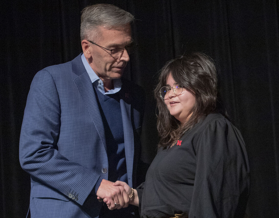 Chancellor Ronnie Green congratulates Dulce Garcia during the Fulfilling the Dream Award presentation on Jan. 25.