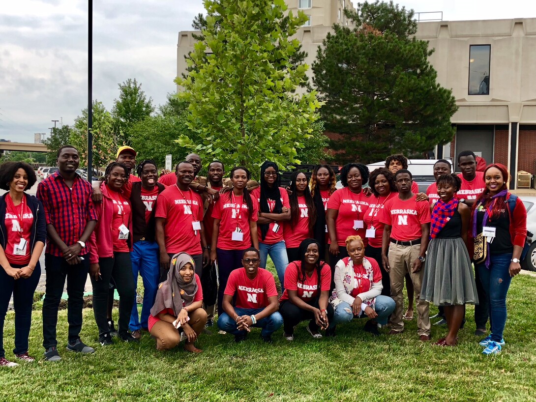 Nebraska's 2018 Mandela fellows pose after planting a tree by the Harper-Schramm-Smith residence hall complex. The planting was in recognition of Nelson Mandela's birthday.