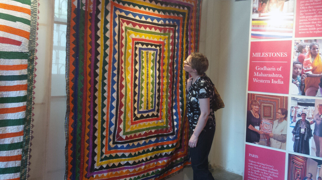 Marin Hanson, curator of exhibits at UNL's International Quilt Study and Museum, examines a quilt during a recent trip to India. Hanson and Leslie Levy, executive director of the museum, went to India to expand the quilt museum's international contacts.