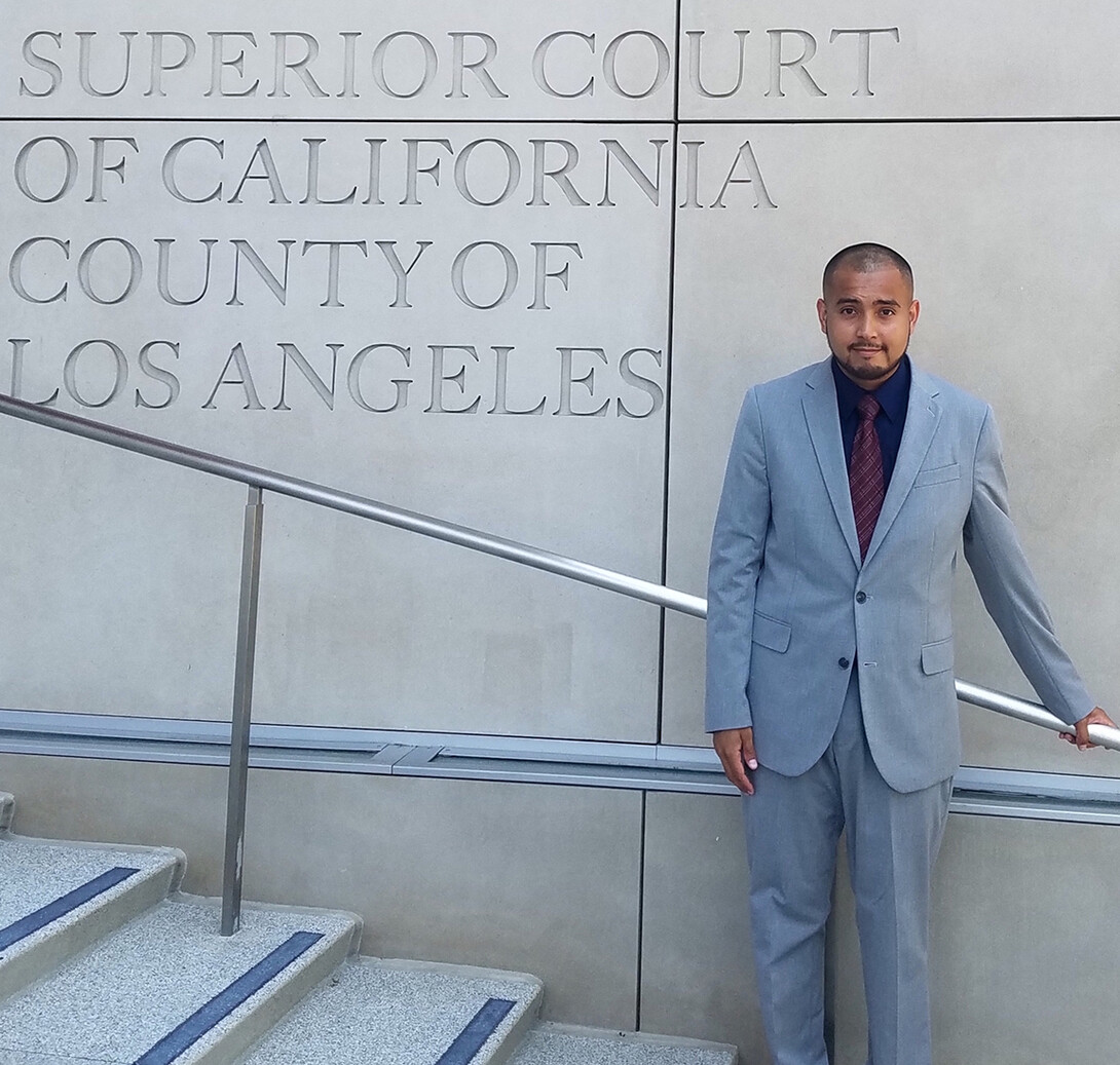 Mauricio Murga Rios stands on the steps of the Los Angeles County's Superior Court of California. In summer 2020, he worked for the immigration unit within Los Angeles County's Public Defender office.