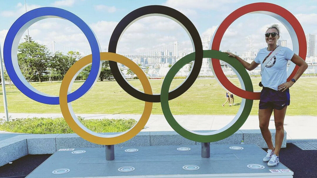 Nebraska's Jordan Larson stands next to the Olympic rings in Tokyo. Larson is playing in her third Olympics, having earned silver in 2012 and bronze in 2016 as part of Team USA's women's volleyball team.