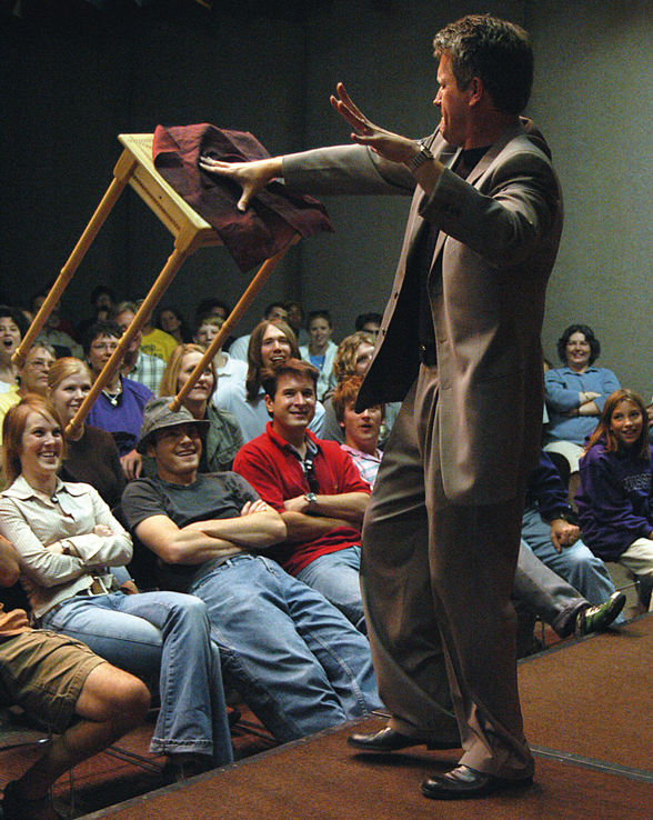 Award-winning performer Craig Karges floats a chair during a performance. Karges is featured in a free Jan. 17 performance at UNL.